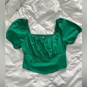 emerald green ruffle sleeved blouse with corset detail